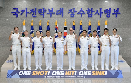 Rear Adm. Kang Dong-goo, commander, Republic of Korea (ROK) Navy Submarine Force, Rear Adm. Lincoln Reifsteck, commander, Submarine Group (CSG) 7, and their staff pose for a picture at Jeju Island, May 16, 2025, for the 60th Submarine Warfare Committee Meeting (SWCM).