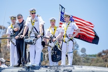 Cmdr. Christopher Rose, center, commanding officer of the Los Angeles-class fast-attack submarine USS Alexandria (SSN 757), observes mooring operations as the boat returns to Naval Base Point Loma following a 7-month deployment to the U.S. Indo-Pacific Command area of responsibility, May 15, 2025.