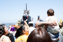 Family and friends watch as the Los Angeles-class fast-attack submarine USS Alexandria (SSN 757) returns to Naval Base Point Loma following a seven-month deployment to the U.S. Indo-Pacific Command area of responsibility, May 15, 2025.