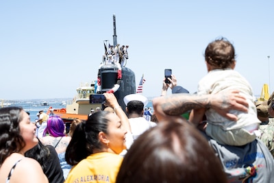 Family and friends watch as the Los Angeles-class fast-attack submarine USS Alexandria (SSN 757) returns to Naval Base Point Loma following a seven-month deployment to the U.S. Indo-Pacific Command area of responsibility, May 15, 2025.