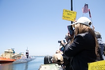 Family and friends watch as the Los Angeles-class fast-attack submarine USS Alexandria (SSN 757) returns to Naval Base Point Loma following a seven-month deployment to the U.S. Indo-Pacific Command area of responsibility, May 15, 2025.