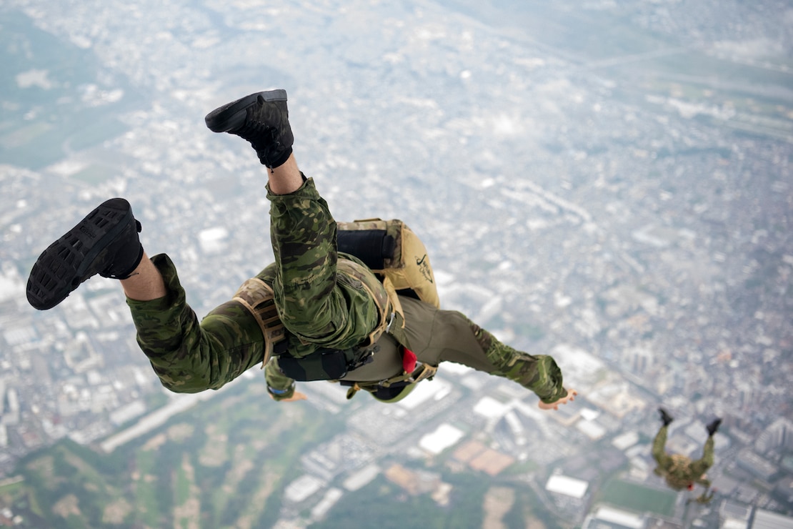 U.S. Marine Corps Marines assigned to the 3rd Reconnaissance Battalion conduct a military free fall demonstration during the Japanese-American Friendship Festival 2025 at Yokota Air Base, Japan, May 18, 2025