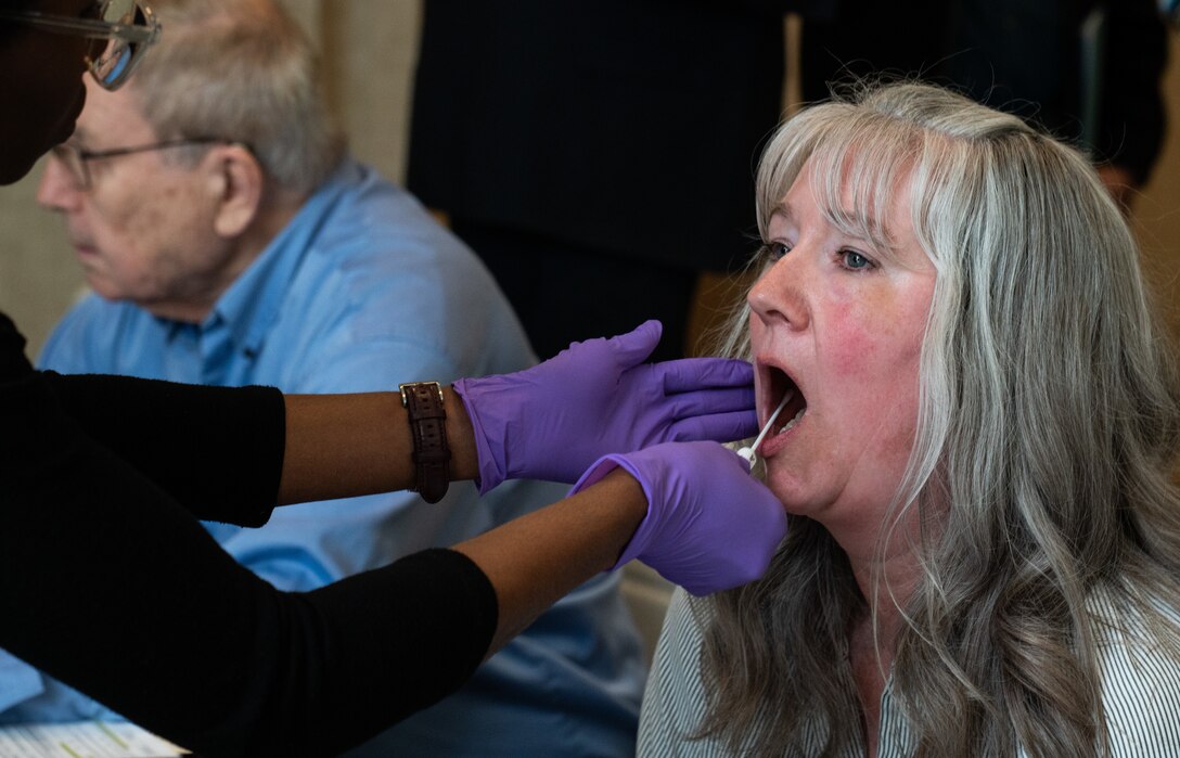 Jennifer McDaniel, family member of a missing in action service member, gives a DNA sample to aid in the potential recovery and identification of her great uncle during a Family Member Update in Bellevue, Washington, May 3, 2025.