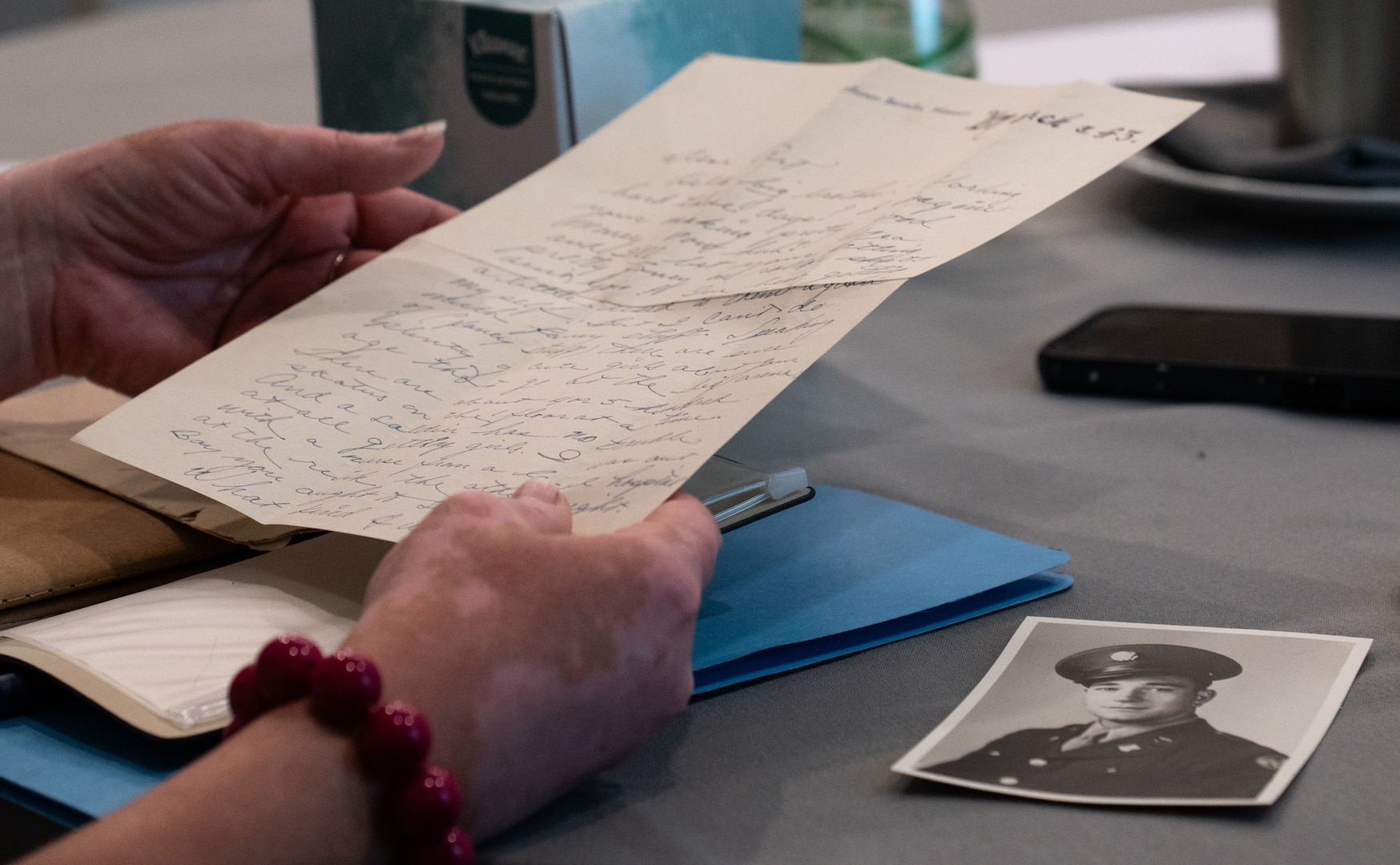 Jennifer McDaniel, family member of a missing in action service member, reads the last letter her great uncle sent before his disappearance during a Family Member Update in Bellevue, Washington, May 3, 2025.