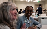 Jennifer McDaniel, family member of a missing in action service member, shares a story about her great uncle with Fern Sumpter Winbush, principal deputy director of the Defense POW/MIA Accounting Agency, during a Family Member Update in Bellevue, Washington, May 3, 2025. McDaniel’s great uncle, Donald Raymond Vogel, enlisted as a private in the U.S. Army Air Forces during World War II, and went missing in April 1943.