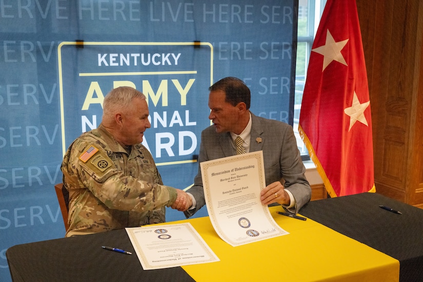 U.S. Army Maj. Gen. Haldane Lamberton (left), Kentucky’s adjutant general, and Dr. Jay Morgan, president of Morehead State University (MSU) shakes hands after signing the memorandum of understanding (MOU) between MSU and KYNG at MSU in Morehead, Ky. on May 5, 2025. KYNG and MSU signed the MOU to give more educational benefits to Soldiers and Airmen of the KYNG. (U.S. Army National Guard photo by Andy Dickson)