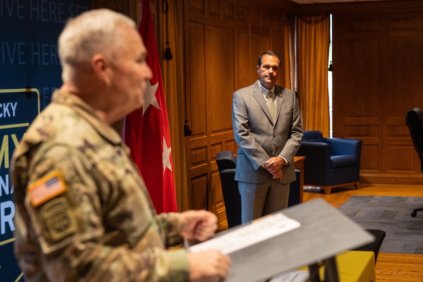 Dr. Jay Morgan, president of Morehead State University (MSU), listens to U.S. Army Maj. Gen. Haldane Lamberton, Kentucky’s adjutant general, speak to the crowd of Kentucky National Guard (KYNG) leaders, recruiters, and MSU faculty and staff during the ceremony of the signing of a memorandum of understanding (MOU) between MSU and KYNG at Morehead State University in Morehead, Ky. on May 5, 2025. KYNG and MSU signed the MOU to give more educational benefits to Soldiers and Airmen of the KYNG. (U.S. Army National Guard photo by Andy Dickson)