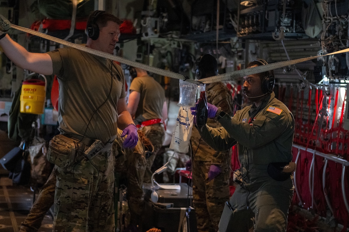 U.S. Air Force Airmen assigned to the 908th Aero-Medical Evacuation Squadron and 71st Rescue Squadron execute an aero-medical evacuation training at Maxwell Air Force Base, Alabama, May 1, 2025. The AE personnel had to receive the patients, triage and ascertain their injuries, and load them in under 15 minutes which was accomplished safely. (U.S. Air Force photo by Airman 1st Class Iain Stanley)