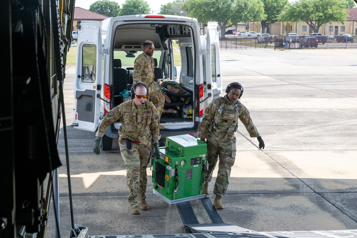 U.S. Air Force Airmen assigned to the 908th Aero-Medical Evacuation Squadron load supplies onto an HC-130J Combat King II for training at Maxwell Air Force Base, Alabama, May 1, 2025. AE personnel used all of the equipment brought onto the aircraft to simulate life saving procedures such as blood transfusions and IV’s. (U.S. Air Force photo by Airman 1st Class Iain Stanley)