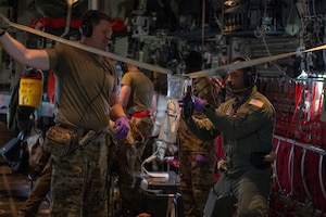 U.S. Air Force Airmen assigned to the 908th Aero-Medical Evacuation Squadron and 71st Rescue Squadron execute an aero-medical evacuation training at Maxwell Air Force Base, Alabama, May 1, 2025. The AE personnel had to receive the patients, triage and ascertain their injuries, and load them in under 15 minutes which was accomplished safely. (U.S. Air Force photo by Airman 1st Class Iain Stanley)