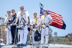 Cmdr. Christopher Rose, center, commanding officer of the Los Angeles-class fast-attack submarine USS Alexandria (SSN 757), observes mooring operations as the boat returns to Naval Base Point Loma following a 7-month deployment to the U.S. Indo-Pacific Command area of responsibility, May 15, 2025.