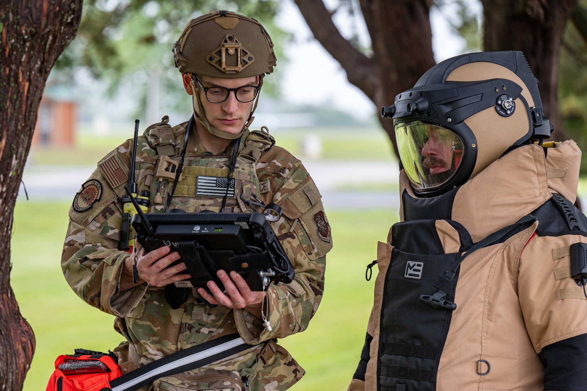 U.S. Air Force Staff Sgt. Luca Hillmeyer, left, 436th Civil Engineer Squadron explosive ordnance disposal technician, and Staff Sgt. Jordan Harper, right, 436th CES EOD technician, views an x-ray image of a suspicious bag during a peacetime improvised explosive device exercise at Dover Air Force Base, Delaware, May 14, 2025.