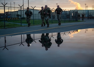 Participants of the Four Chaplain Memorial Run and Ruck progress through the Norwegian Foot March at Osan Air Base, Republic of Korea, May 17, 2025. The event honored the sacrifice of four chaplains that helped panicked soldiers to safety after a U.S. Army transport ship was hit by a torpedo during World War II. (U.S. Air Force photo by Senior Airman Sarah Williams)