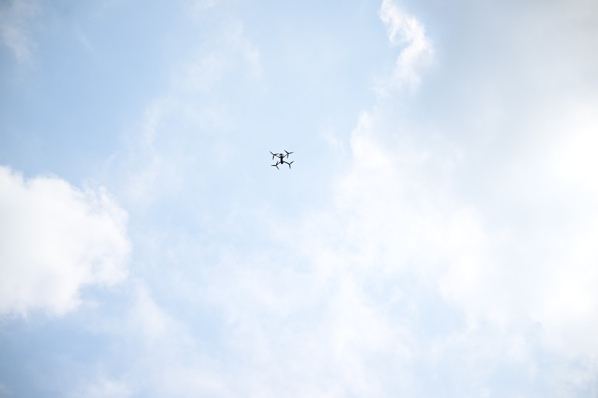 A drone flies in the sky.