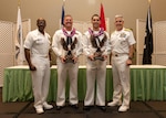 Adm. Steve Koehler, commander, U.S. Pacific Fleet (COMPACFLT), right, and COMPACFLT Master Chief Don Davis, left, pose for a photo with Aviation Structural Mechanic 1st Class Joseph Hopkins, the COMPACFLT shore Sailor of the Year (SOY), center left, and Hospital Corpsman 1st Class Andrew Velikic, the COMPACFLT sea SOY, center right, during the COMPACFLT SOY announcement ceremony in Honolulu, May 14, 2025. The SOY program, established in 1972, recognizes those who exemplify a warfighting spirit, the Navy’s core values, and a deep commitment to their commands and communities. (U.S. Navy photo by Mass Communication Specialist 2nd Class Christopher Sypert)
