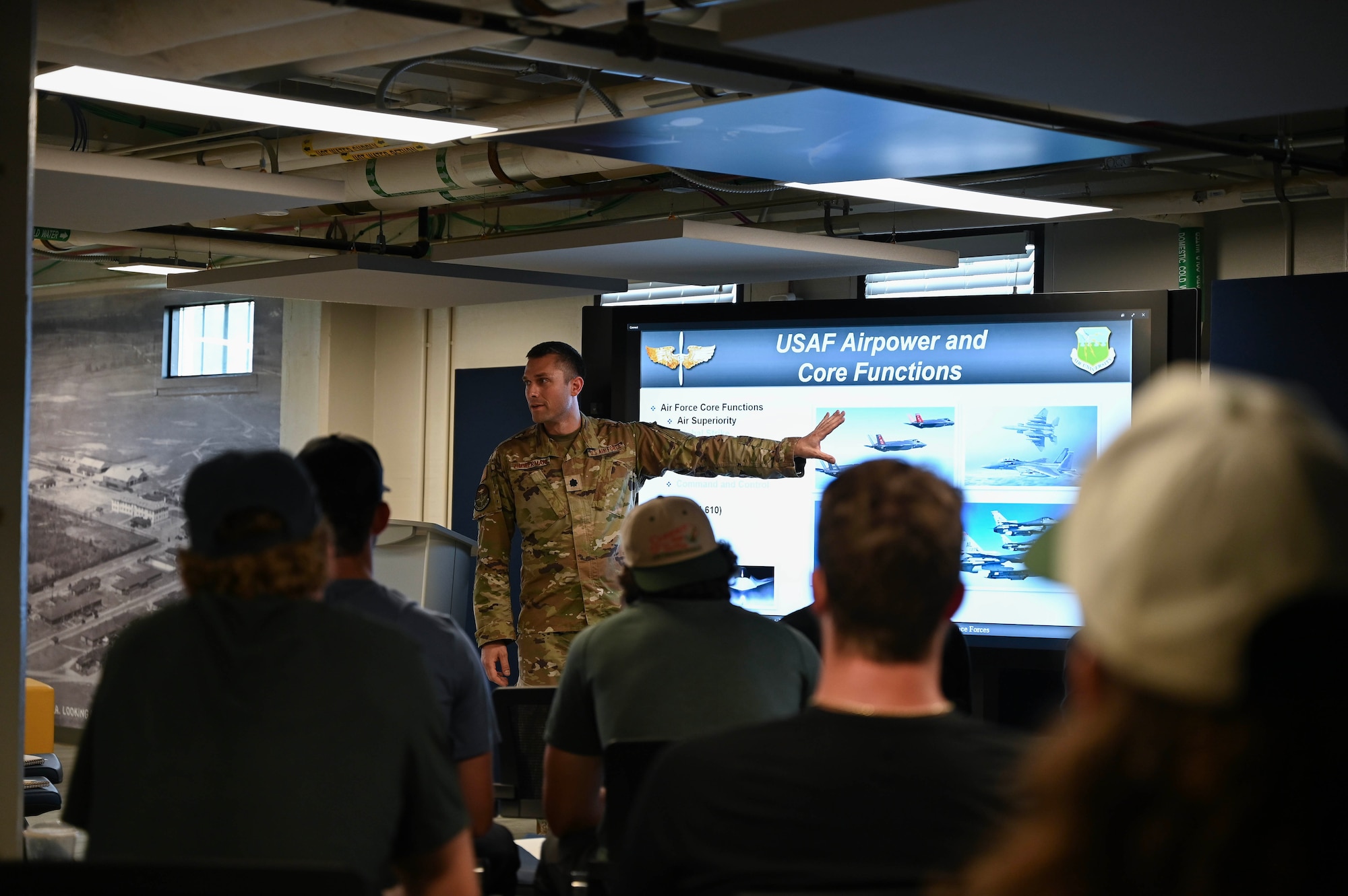 Global College of PME course director briefs local sports team