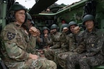 U.S. Army Command Sgt. Maj. Jack Love, U.S. Forces Korea Senior Enlisted Advisor (right), along with U.S and ROK senior leaders pose inside an AAVP-7A1 Amphibious Assault Vehicle during the Ulchi Freedom Shield Battlefield Circulation, Aug. 22, 2024.
