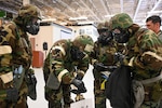Aircrew members with the 168th Wing Operations Group participate in hands-on CBRN training during the May drill weekend at Eielson Air Force Base, Alaska, May 3, 2025. The training, led by the Wing’s Emergency Management specialists, focused on decontamination procedures, protective gear use, post-attack reconnaissance sweeps, and mock threat scenarios to reinforce mission readiness and operational capability in high-threat environments. CBRN training is crucial for maintaining operational readiness and ensuring Airmen can protect personnel and mission-critical assets effectively. The training reinforces the Wing’s capability to mobilize to support wartime tasking.