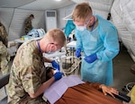 U.S. Air Force Maj, Kyle Sansom, 151st Medical Group (MDG), Utah Air National Guard, and Staff Sgt. Joel Farmer, 124th Medical Group, provide dental care to a Moroccan patient during the Humanitarian Civic Assistance event at African Lion 2025 (AL25), in Anzi, Morocco, May 11, 2025. AL25, the largest annual military exercise in Africa, will take place from April 14 to May 23, 2025. Led by U.S. Africa Command with over 10,000 troops from more than 50 nations, including seven NATO allies, across Ghana, Morocco, Senegal, and Tunisia. The exercise aims to bolster military readiness, enhance lethality, and foster stronger partnerships, ultimately improving joint capabilities in complex multi-domain environments to enable participating forces to deploy, fight, and win. This photo was altered for patient privacy.