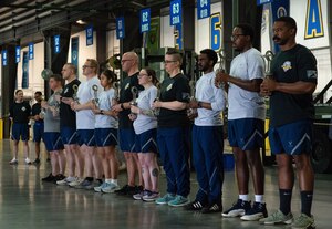 Members of the 436th Aerial Port Squadron stand in position during the 2025 Port Dawg Memorial Run event at Dover Air Force Base, Delaware, May 16, 2025. Fellow Port Dawgs paid tribute to the 10 fallen Port Dawgs lost in the past year, including two members of Team Dover. (U.S. Air Force photo by Roland Balik)