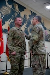 Maj. Gen. Thomas H. Mancino, adjutant general for Oklahoma, presents 1st Sgt. Matthew Klemann, Echo Company, 700th Brigade Support Battalion, with the Oklahoma Star of Valor award at the Armed Forces Reserves Center in Norman, Oklahoma, May 18, 2025. The medal is Oklahoma’s second-highest military award and honors Oklahoma National Guard members who perform heroic or valorous acts in non-combat situations. Klemann received the Star of Valor for his quick and courageous action in administering the Heimlich maneuver during a retirement ceremony in 2021. (Oklahoma National Guard photo by Spc. Cambrie Cannon)