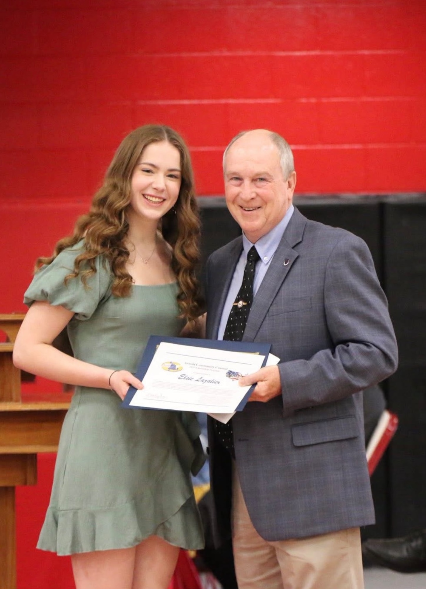 Elsie Lazalier of Coffee County High School receives the Mike Niederhauser Memorial Scholarship from ACC member, Don Wheeler. (Photo Provided)
