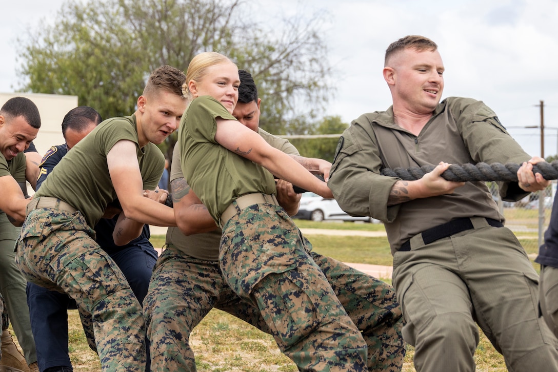 U.S. Marines and civilians with the Provost Marshal’s Office, Marine Corps Air Station Miramar, participate in a tug-of-war match between the Naval Consolidated Brig and the PMO on MCAS Miramar, California, May 13, 2025.