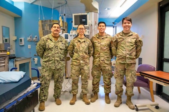 250219-O-NJ595-1096, Portsmouth, Virginia, (Jan. 29, 2025) From left to right, Biomedical Technicians (BMET) Chief Eric Garcia, Sgt. Ariane Nunley, Senior Airman Victor Maldonado, and Senior Airman Brett Lucas pose for a photo after the conclusion of their annual equipment checks Jan. 29, 2025, Naval Medical Center Portsmouth, Virginia. BMET’s use their expertise to ensure life-saving technologies, field medical systems, and laboratory equipment function reliably in both the operational and clinical settings. The annual equipment checks are conducted to ensure that all the equipment is working properly and calibrated to present accurate data. During the gear check, biomedical specialists from the Army, Airforce, and Navy participated with the inventory and diagnostical checks for the equipment in the hospital. (U.S. Navy photo by Desmond Martin)