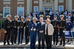 U.S. Coast Guard Academy (USCGA) Superintendent Rear Adm. Mike Johnston, Dr. James Tyler (front left to right) and regimental staff pose for a photo during regimental review at USCGA, New London, Connecticut, May 20, 2025. USCGA recognized Dr. James Tyler with the Scientæ Cedit Mare Award which reflects the importance of knowledge and education in mastering the challenges of the sea. (U.S. Coast Guard photo by Petty Officer Third Class Leo Avila.)