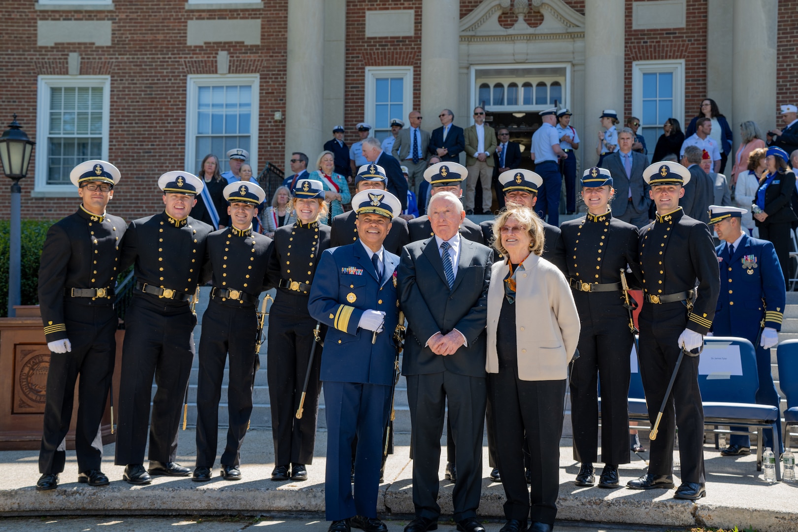 U.S. Coast Guard Academy (USCGA) Superintendent Rear Adm. Mike Johnston, Dr. James Tyler (front left to right) and regimental staff pose for a photo during regimental review at USCGA, New London, Connecticut, May 20, 2025. USCGA recognized Dr. James Tyler with the Scientæ Cedit Mare Award which reflects the importance of knowledge and education in mastering the challenges of the sea. (U.S. Coast Guard photo by Petty Officer Third Class Leo Avila.)