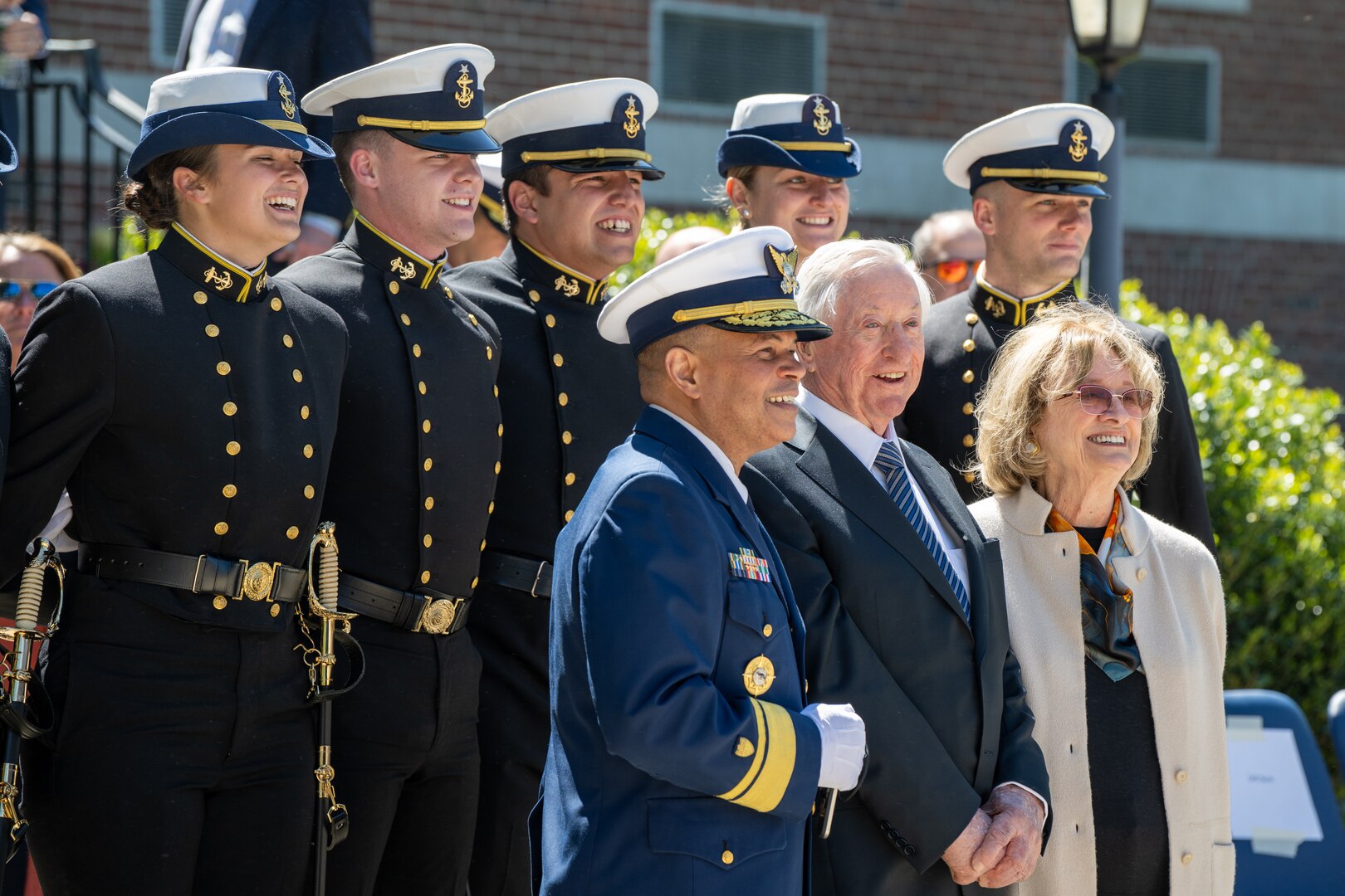 U.S. Coast Guard Academy (USCGA) Superintendent Rear Adm. Mike Johnston, Dr. James Tyler (front left to right) and regimental staff pose for a photo during regimental review at USCGA, New London, Connecticut, May 20, 2025. USCGA recognized Dr. James Tyler with the Scientæ Cedit Mare Award which reflects the importance of knowledge and education in mastering the challenges of the sea. (U.S. Coast Guard photo by Petty Officer Third Class Leo Avila.)