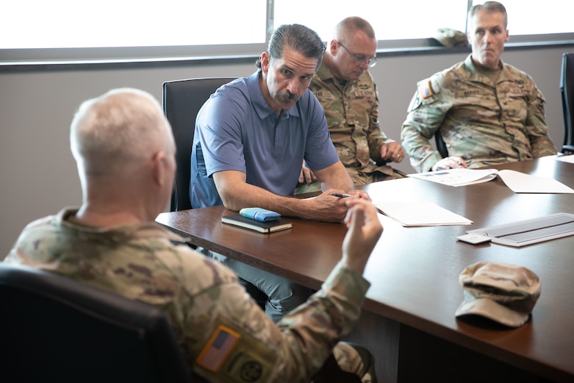 U.S. Army Maj. Gen. Haldane Lamberton, Kentucky adjutant general, talks with Kentucky civilian aide to the Secretary of the Army (CASA), retired U.S. Army Col. Lance O’Bryan, at Boone National Guard Center, Frankfort, April 30, 2025. Kentucky National Guard senior leadership along with directorates met with O’Bryan to highlight the Kentucky National Guard and the organization’s capabilities.  (U.S. Army photo by Milt Spalding)