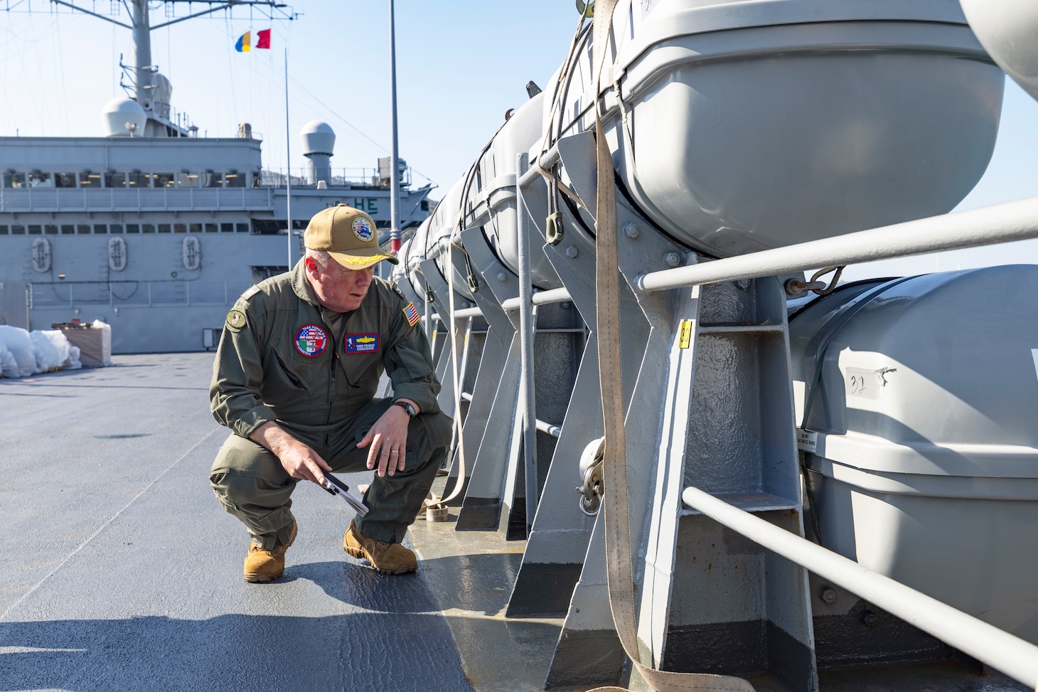 Capt. Todd B. Penrod, Commander, Task Force SIX THREE, Commander, Military Sealift Command Europe & Africa inspects a weld on a life boat stanchion aboard the Blue Ridge-class command and control ship USS Mount Whitney (LCC 20) April 11. Penrod visited the ship to engage with the crew and conduct a ship check following the completion of regularly scheduled voyage repairs.