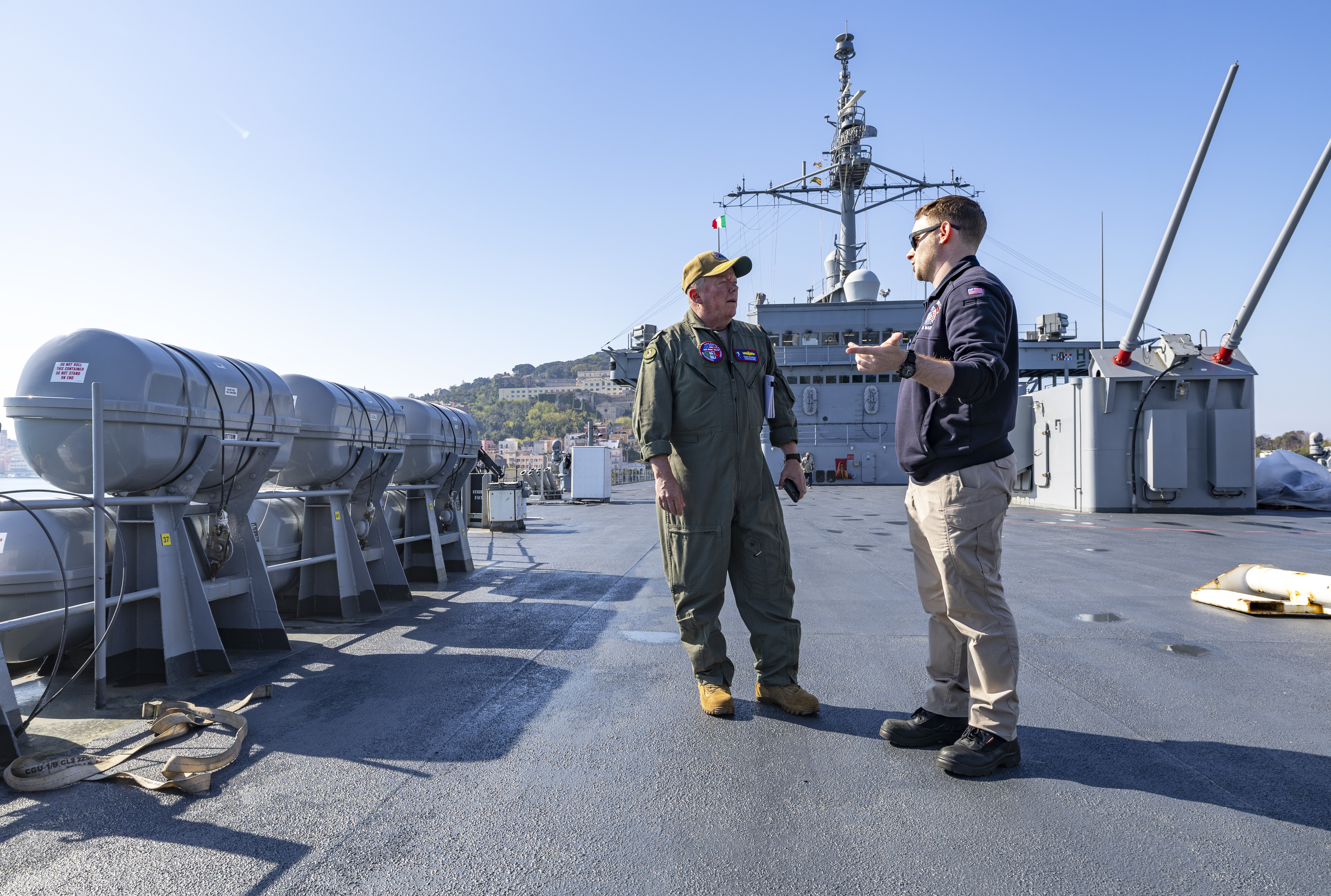 Capt. Todd B. Penrod, Commander, Task Force SIX THREE, Commander, Military Sealift Command Europe & Africa (left) discusses recently completed voyage repairs with Capt. Joshua Becker, Officer-in-Charge, USS Mount Whitney (LCC 20) aboard the Blue Ridge-class command and control ship April 11. Penrod visited the ship to engage with the crew and conduct a ship check following the completion of regularly scheduled voyage repairs.