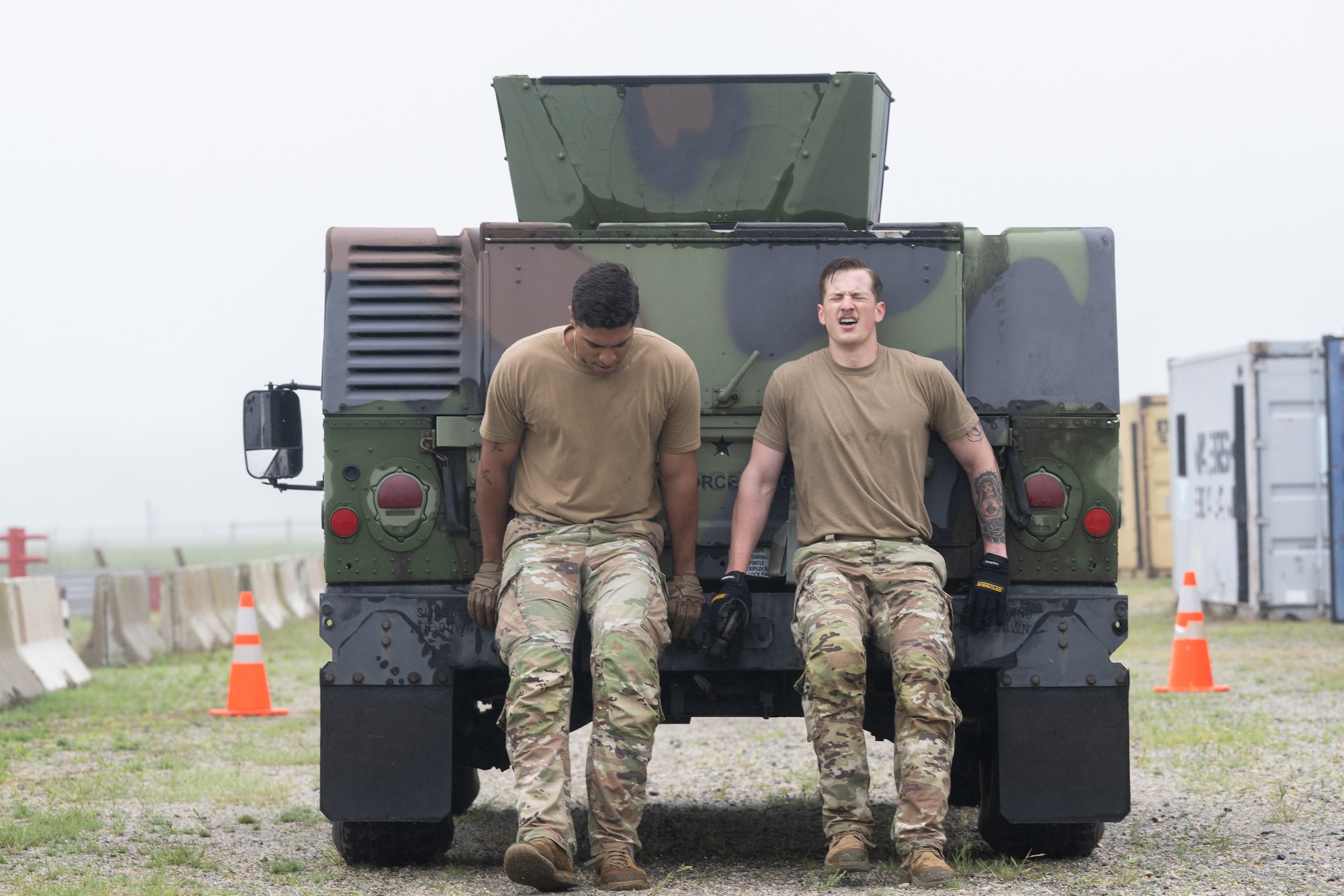 U.S. Air Force 2nd Lt. Samuel Kinney, right, 436th Aerial Port Squadron ramp operations officer in charge, and 2nd Lt. Julian Lopez Purcell, 436th APS Passenger and Fleet flight commander, pushes a vehicle during the Defender Challenge at Dover Air Force Base, Delaware, May 14, 2025. The event, which entailed teams of two performing various physical challenges, was part of Dover AFB’s 2025 Police Week observance. (U.S. Air Force photo by Mauricio Campino)