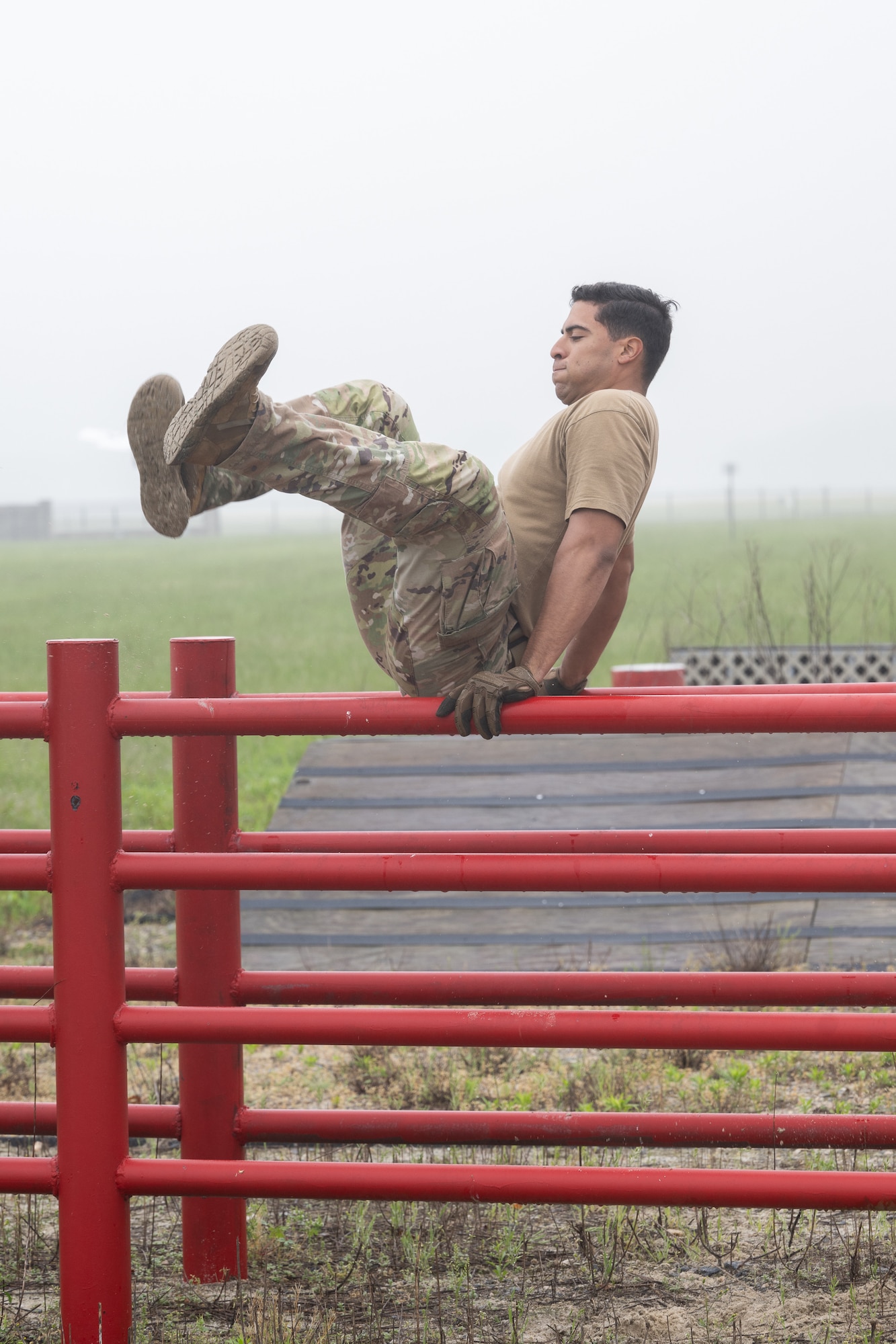 U.S. Air Force 2nd Lt. Julian Lopez Purcell, 436th Aerial Port Squadron Passenger and Fleet flight commander, maneuvers through an obstacle course during the Defender Challenge at Dover Air Force Base, Delaware, May 14, 2025. The event, which entailed teams of two performing various physical challenges, was part of Dover AFB’s 2025 Police Week observance. (U.S. Air Force photo by Mauricio Campino)