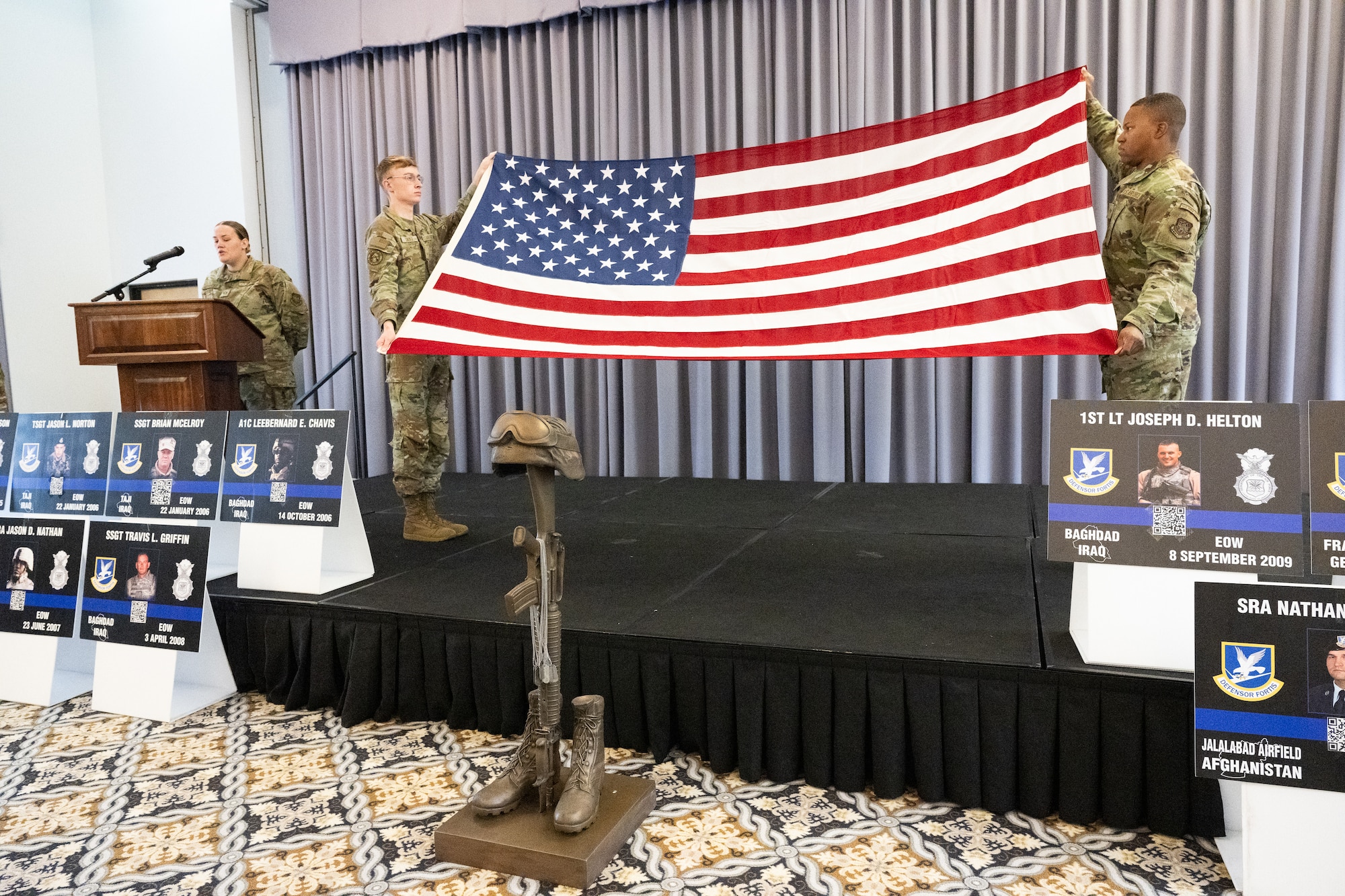 Members of Team Dover conduct a flag folding ceremony during a memorial service at the conclusion of Police Week at Dover Air Force Base, Delaware, May 16, 2025. National Police Week was established in 1962 to honor law enforcement officers and to commemorate those who have lost their lives in the line of duty. (U.S. Air Force photo by Mauricio Campino)