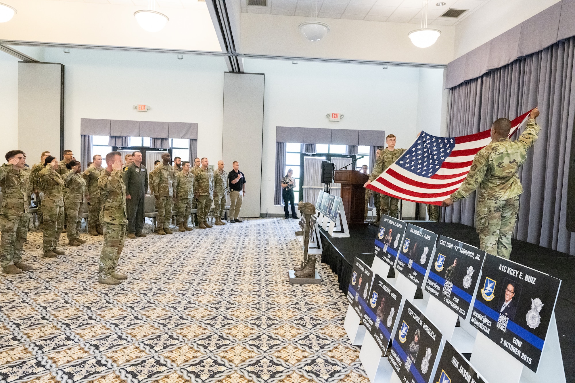 Members of Team Dover salute during a ceremony at a memorial service at the conclusion of Police Week at Dover Air Force Base, Delaware, May 16, 2025. National Police Week was established in 1962 to honor law enforcement officers and to commemorate those who have lost their lives in the line of duty. (U.S. Air Force photo by Mauricio Campino)