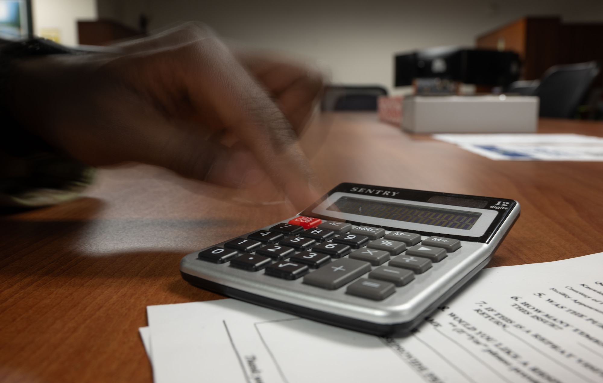 U.S. Air Force Senior Airman Kobina Nunoo, 436th Comptroller Squadron financial operation technician, uses a calculator at Dover Air Force Base, Delaware, May 1, 2025. The 436th CPTS is responsible for funds accounting and budget planning, programming, execution and analysis. The squadron also supports Air Mobility Command worldwide mobility requirements through funds disbursement, travel order processing and deployment of personnel. (U.S. Air Force photo by Airman 1st Class Liberty Matthews)