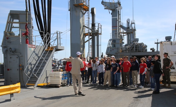 Twenty-three students of the Governor’s Science, Technology, Engineering, and Mathematics (STEM) Academy in Chesapeake, Va., visited Military Sealift Command’s (MSC) USNS Joshua Humphreys (T-AO 188) on April 24, 2025. Pictured center is Chief Mate Miles Faver, explaining the two types of replenishment services Joshua Humphreys provides the warfighting ships at sea.