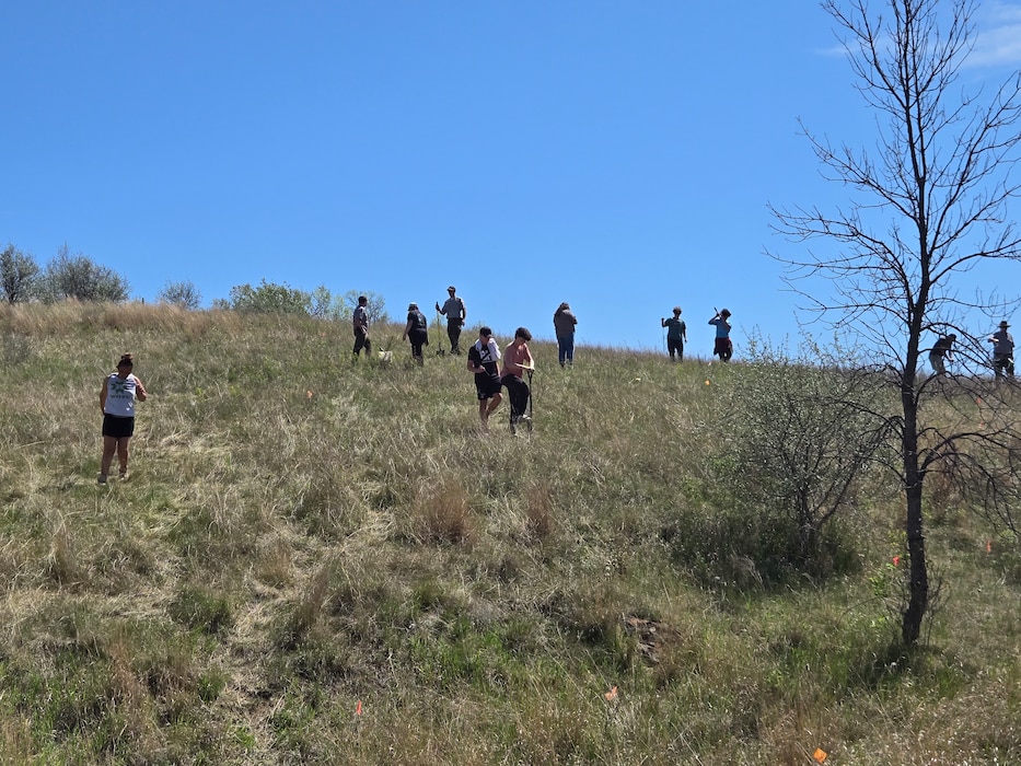 U.S. Army Corps of Engineers staff from the Omaha District’s Oahe Project work alongside students from Bismarck Public Schools, May 12, 2025, during a native tree planting event along the WOZU bike trail near the Cannonball River, N.D.