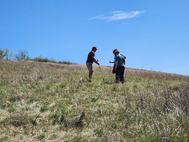 A WOZU team member provides guidance to students planting native trees along the Cannonball River, N.D., during a joint project with the U.S. Army Corps of Engineers, Omaha District’s Oahe Project, May 12, 2025.