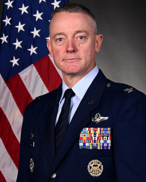 Man in uniform poses for photo