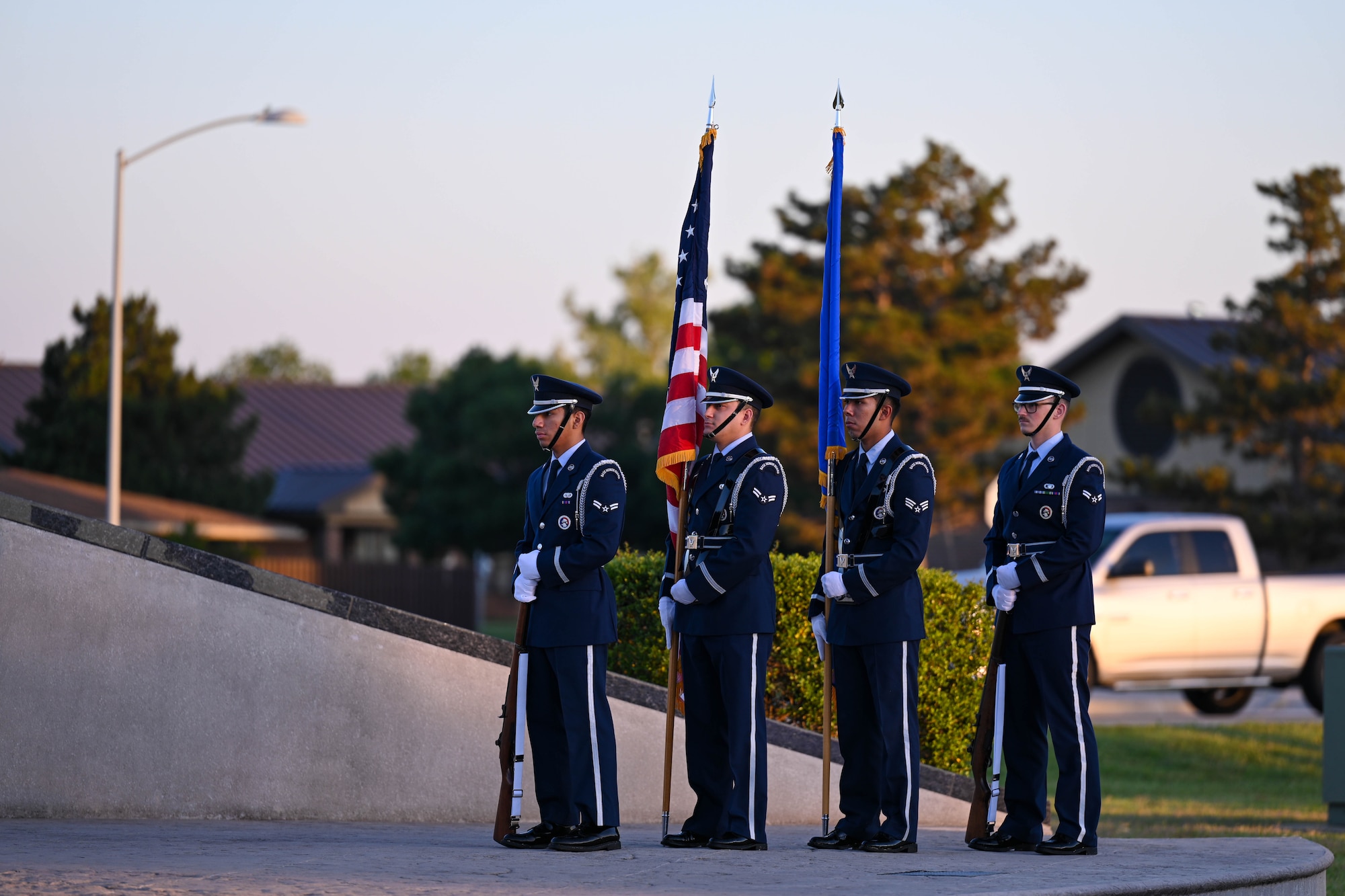Blue Knights honor guard Airmen stand by at Altus Air Force Base, Oklahoma, May 11, 2025. The team presented the U.S. flag during reveille for the opening ceremony of 2025 National Police Week, a week dedicated to honor fallen defenders and law enforcement. (U.S. Air Force photo by Airman1st Class Lauren Torres)