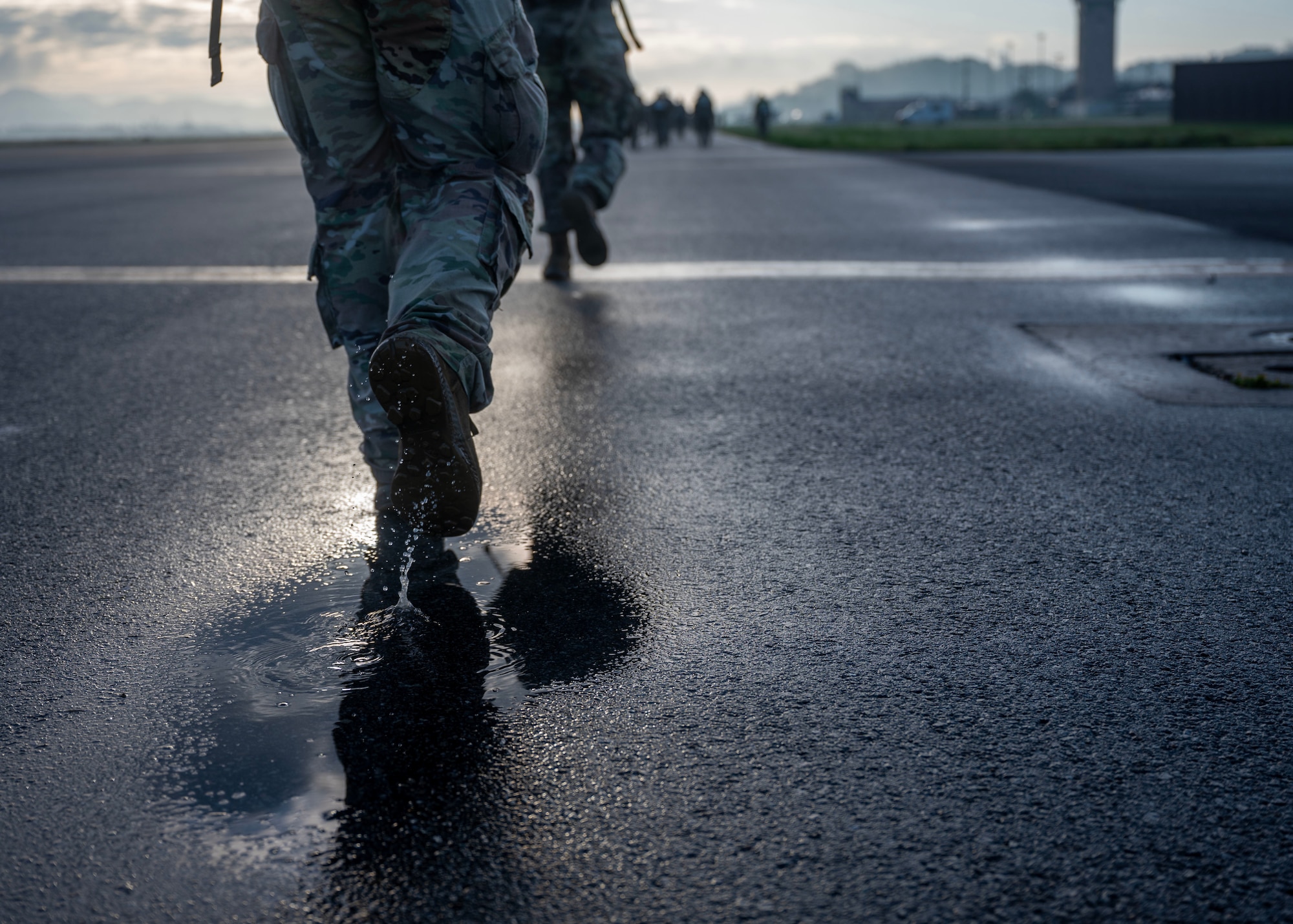 Participants of the Four Chaplain Memorial Run and Ruck march through the Norwegian Foot March at Osan Air Base, Republic of Korea, May 17, 2025. Originally founded in Norway, the event has become internationally recognized and is held in several countries around the world, often coordinated by military units. (U.S. Air Force photo by Senior Airman Sarah Williams)