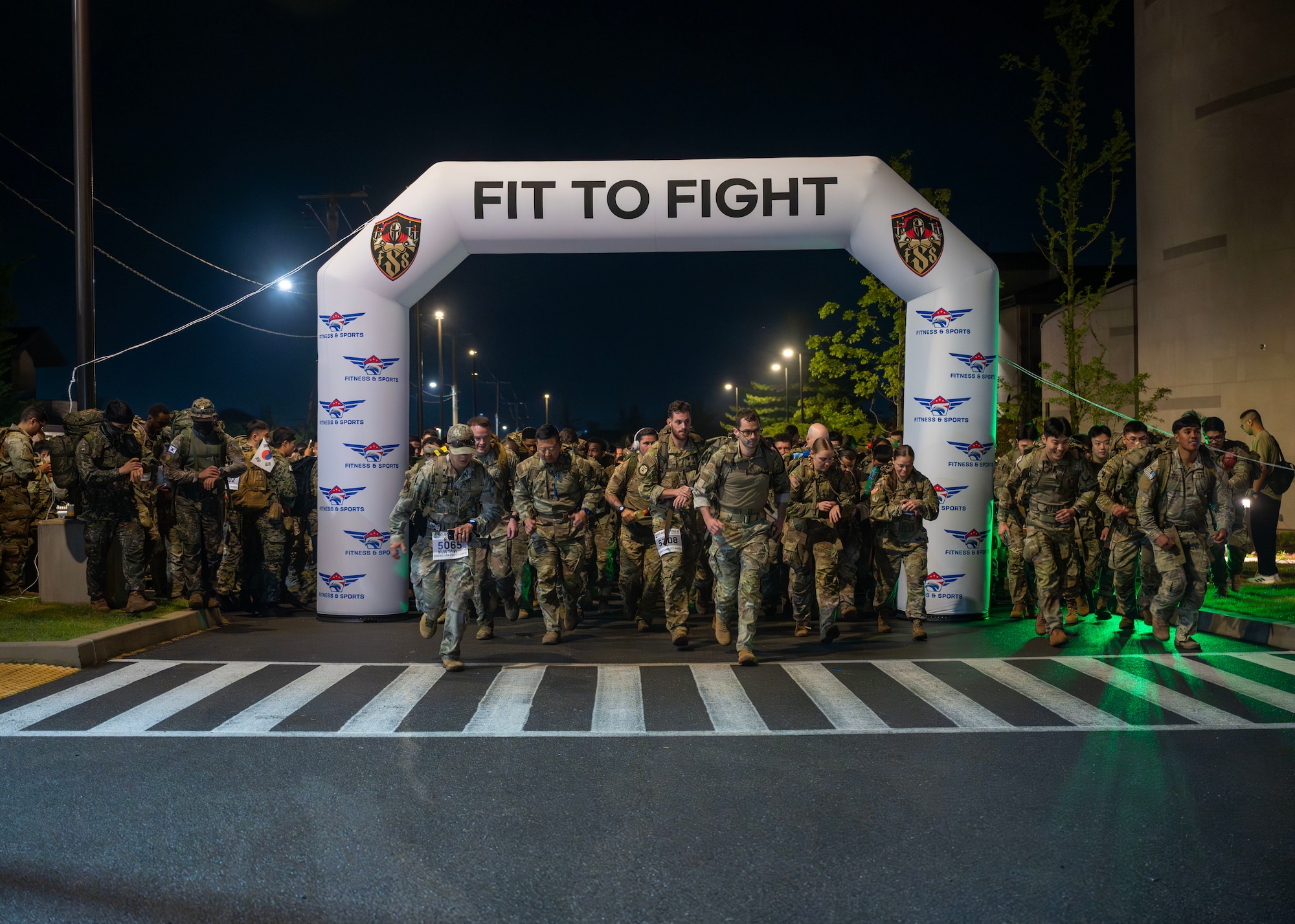 Participants begin the Four Chaplain Memorial Run and Ruck at Osan Air Base, Republic of Korea, May 17, 2025. The event featured the Norwegian Foot March, a long-standing military event that challenges participants to march 18.6 miles while carrying a minimum of 25 pounds, completing the ruck within the time set for their age group. (U.S. Air Force photo by Senior Airman Sarah Williams)
