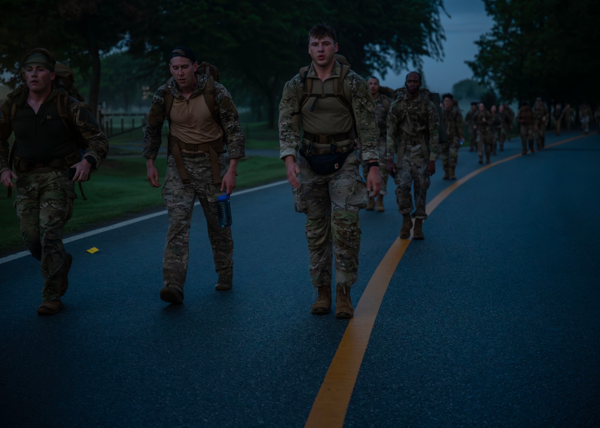Participants of the Four Chaplain Memorial Run and Ruck advance through the Norwegian Foot March course at Osan Air Base, Republic of Korea, May 17, 2025. The event honored the sacrifice of four chaplains that helped panicked soldiers to safety after a U.S. Army transport ship was hit by a torpedo during World War II. (U.S. Air Force photo by Senior Airman Sarah Williams)