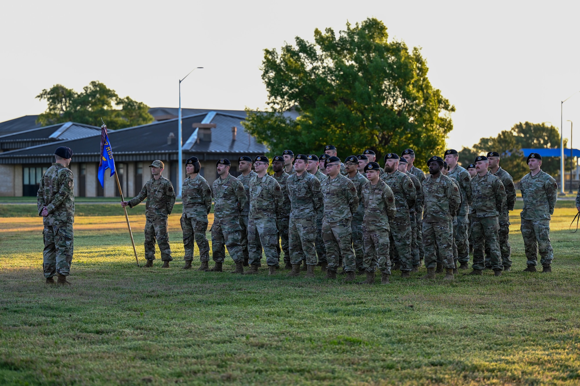 Airmen from the 97th Security Forces Squadron stand at parade rest, during the 2025 National Police Week opening ceremony at Altus Air Force Base, Oklahoma, May 11, 2025. Police Week was established in 1962 by former President John F. Kennedy. (U.S. Air Force photo by Airman 1st Class Lauren Torres)