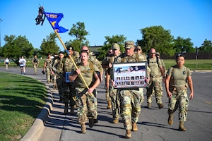 Airmen from the 97th Security Forces Squadron ruck together for the Ruck of Remembrance at Altus Air Force Base, Oklahoma, May 13, 2025. The Ruck of Remembrance is a yearly tradition held during police week. (U.S. Air Force photo by Airman 1st Class Nathan Langston)