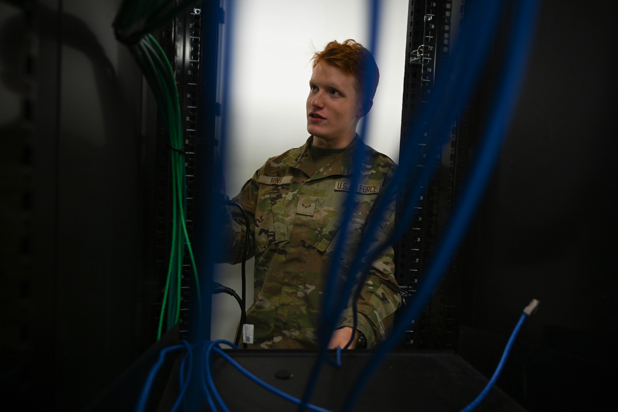 An Airman inspects an outlet point.